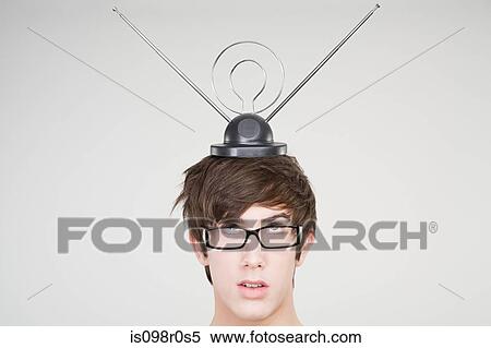 A teenage boy with an antenna on his head View Large Photo Image Stock Photography - A teenage boy with an antenna on his head. Fotosearch
