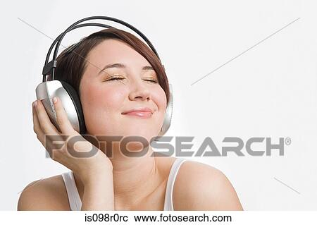 A teenage girl listening to music View Large Photo Image Stock Image - A teenage girl listening to music. Fotosearch
