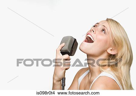 A young woman singing View Large Photo Image Picture - A young woman singing. Fotosearch