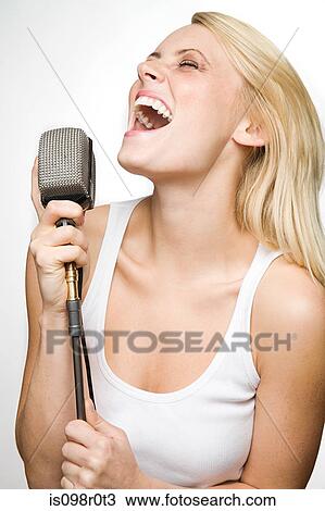 A young woman singing View Large Photo Image Stock Image - A young woman singing. Fotosearch