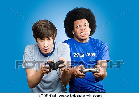 Friends playing a video game View Large Photo Image Stock Photograph - Friends playing a video game. Fotosearch