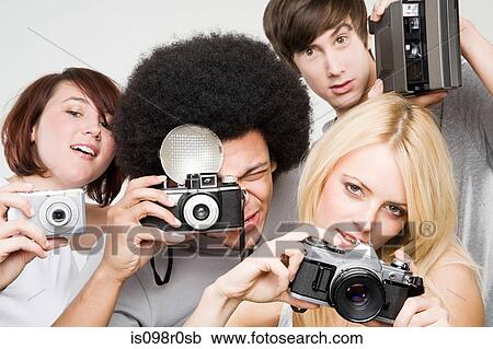 Stock Image - Friends taking pictures. Fotosearch