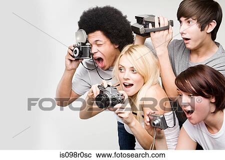 Stock Image - Friends taking pictures. Fotosearch