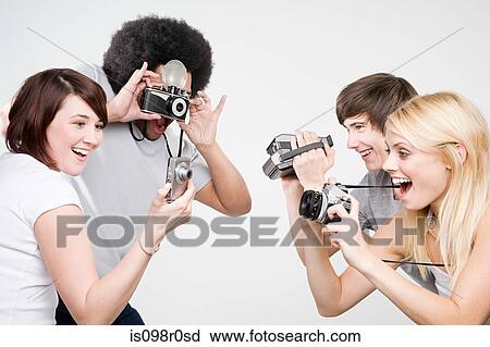 Friends taking pictures View Large Photo Image Stock Image - Friends taking pictures. Fotosearch