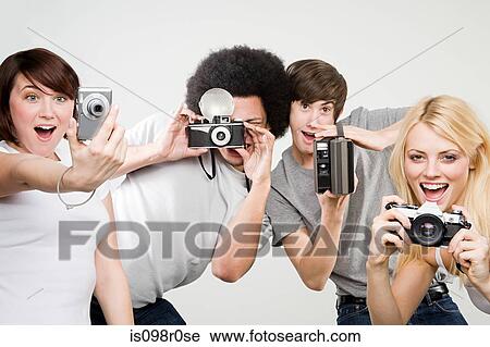 Stock Image - Friends taking pictures. Fotosearch