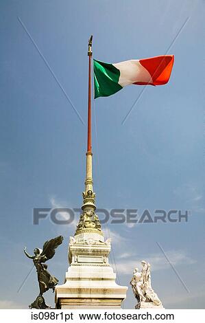 Stock Photograph - Italian flag on top of the victor emmanuel monument. Fotosearch