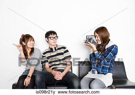 Friends with instant camera View Large Photo Image Stock Photo - Friends with instant camera. Fotosearch
