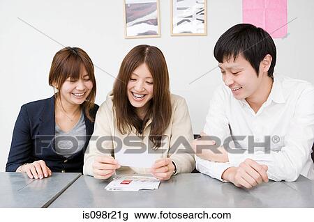 People looking at photographs View Large Photo Image Stock Image - People looking at photographs. Fotosearch