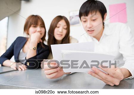 People looking photographs View Large Photo Image Picture - People looking photographs. Fotosearch