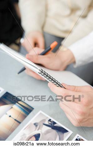 People with notepad and photographs View Large Photo Image Stock Image - People with notepad and photographs. Fotosearch