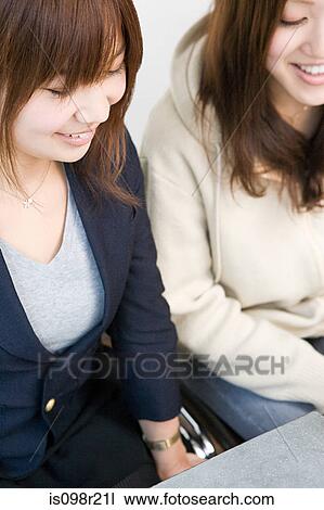 Two young women View Large Photo Image Stock Image - Two young women. Fotosearch