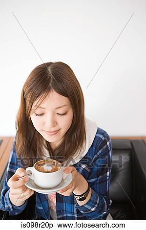 Young woman with cappuccino View Large Photo Image Stock Photography - Young woman with cappuccino. Fotosearch