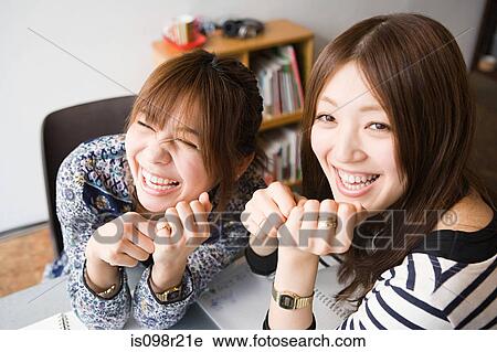 Young women laughing View Large Photo Image Stock Image - Young women laughing. Fotosearch