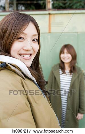 Young women outdoors View Large Photo Image Stock Photo - Young women outdoors. Fotosearch