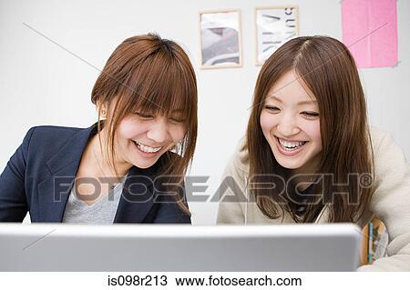 Young women with laptop View Large Photo Image Stock Image - Young women with laptop. Fotosearch