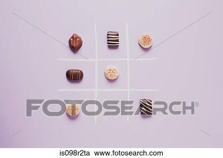 Chocolates on grid View Large Photo Image Stock Image - Chocolates on grid. Fotosearch