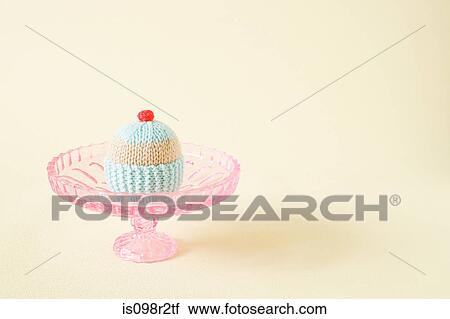 Knitted cupcake on a cakestand View Large Photo Image Stock Image - Knitted cupcake on a cakestand. Fotosearch