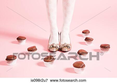 Legs of woman and cakes View Large Photo Image Stock Photo - Legs of woman and cakes. Fotosearch