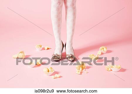 Legs of woman and cakes View Large Photo Image Stock Photo - Legs of woman and cakes. Fotosearch