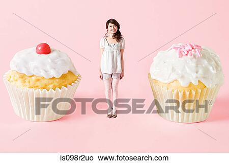 Small woman and big cakes View Large Photo Image Picture - Small woman and big cakes. Fotosearch