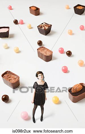 Small woman and big candy View Large Photo Image Stock Photo - Small woman and big candy. Fotosearch