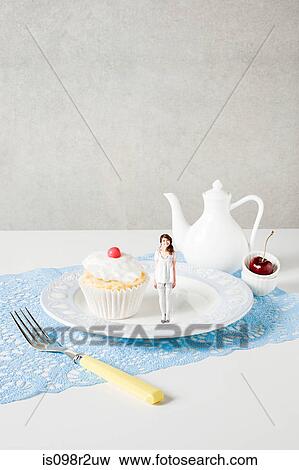 Small woman on plate View Large Photo Image Stock Photo - Small woman on plate. Fotosearch