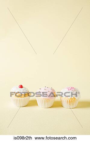 Three cupcakes View Large Photo Image Stock Image - Three cupcakes. Fotosearch