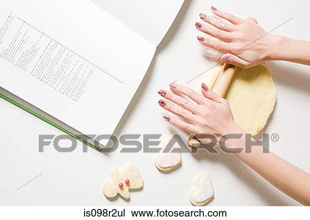 Woman making biscuits View Large Photo Image Stock Image - Woman making biscuits. Fotosearch