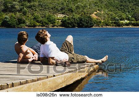 Friends on a jetty View Large Photo Image Picture - Friends on a jetty. Fotosearch