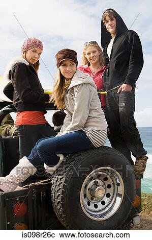 Friends on off road vehicle View Large Photo Image Stock Image - Friends on off road vehicle. Fotosearch