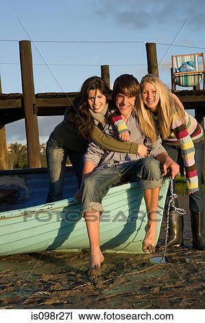 Friends with rowboat View Large Photo Image Stock Image - Friends with rowboat. Fotosearch