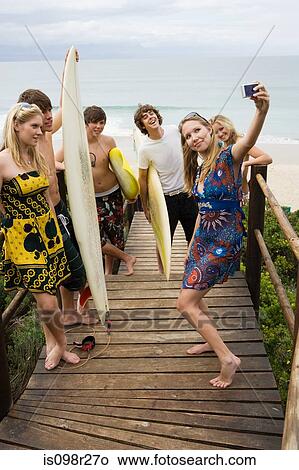 Surfer friends with camera View Large Photo Image Picture - Surfer friends with camera. Fotosearch