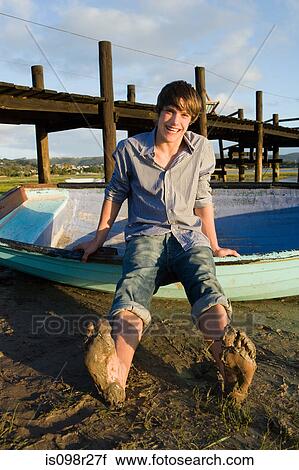 Teenage boy with rowboat View Large Photo Image Stock Image - Teenage boy with rowboat. Fotosearch