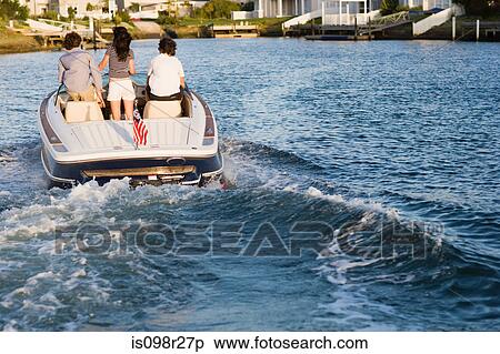 Teenager on motorboat View Large Photo Image Stock Photography - Teenager on motorboat. Fotosearch