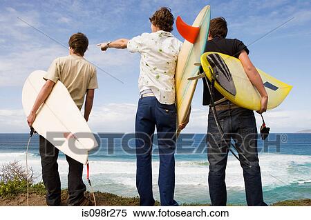 Stock Photography - Three surfers. Fotosearch