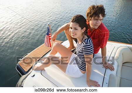 Young couple on boat View Large Photo Image Stock Image - Young couple on boat. Fotosearch