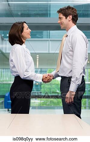Stock Photo - Businesspeople shaking hands. Fotosearch