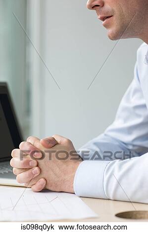 Man at his desk View Large Photo Image Stock Image - Man at his desk. Fotosearch