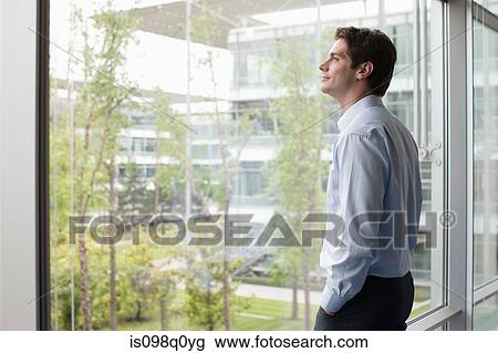 Man looking through window View Large Photo Image Stock Image - Man looking through window. Fotosearch