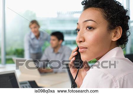 Office worker on telephone View Large Photo Image Stock Image - Office worker on telephone. Fotosearch