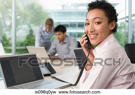 Office worker on telephone View Large Photo Image Stock Photo - Office worker on telephone. Fotosearch