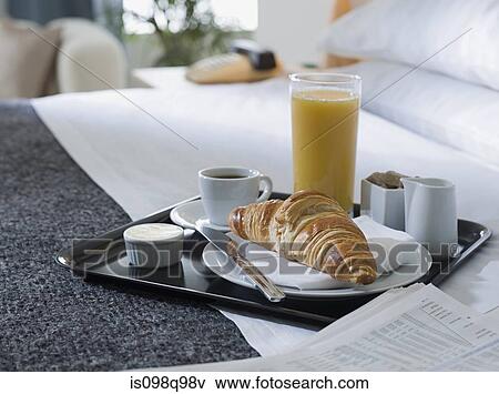 Breakfast tray on a hotel bed View Large Photo Image Stock Photo - Breakfast tray on a hotel bed. Fotosearch
