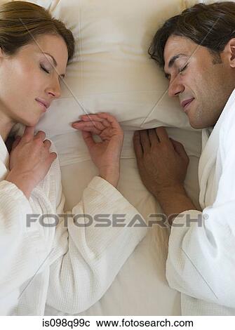 Couple sleeping in bed View Large Photo Image Stock Image - Couple sleeping in bed. Fotosearch