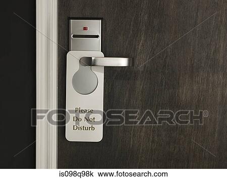 Stock Image - Do not disturb sign on a hotel room door. Fotosearch