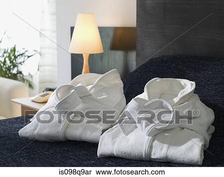 Folded bathrobes on a hotel bed View Large Photo Image Stock Photography - Folded bathrobes on a hotel bed. Fotosearch