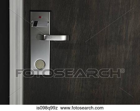 Key in a hotel room door View Large Photo Image Stock Photo - Key in a hotel room door. Fotosearch
