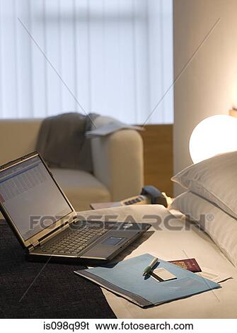 Laptop computer on a hotel bed View Large Photo Image Stock Photograph - Laptop computer on a hotel bed. Fotosearch