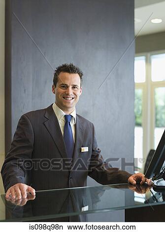 Picture - Man at a hotel reception. Fotosearch