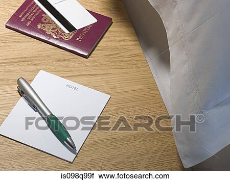 Passport and pen on bedside table View Large Photo Image Stock Image - Passport and pen on bedside table. Fotosearch