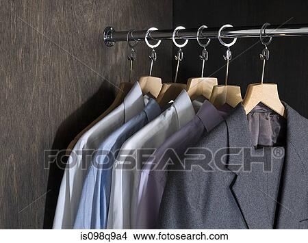 Shirts and suits in a closet View Large Photo Image Picture - Shirts and suits in a closet. Fotosearch